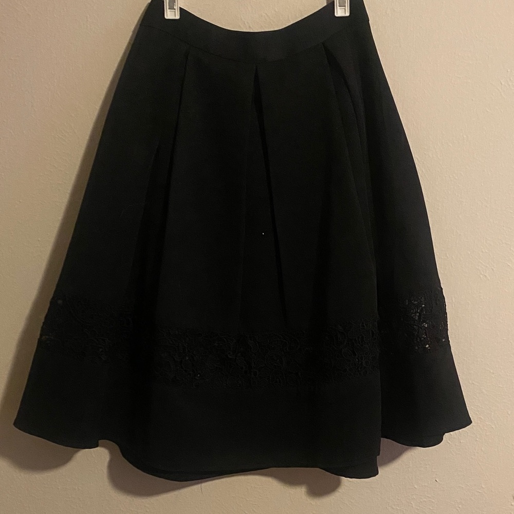 Elegant Black Pleated Skirt with Lace Detail